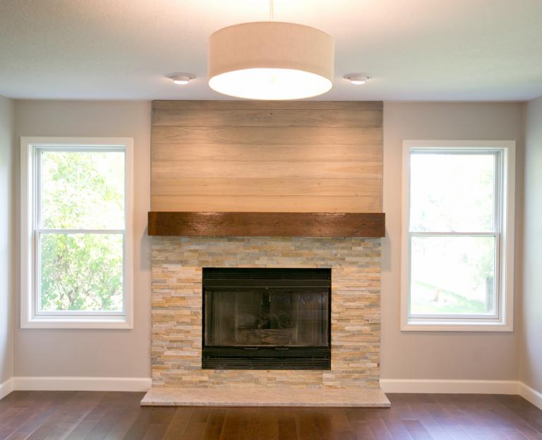 Horizontal wood planks above fireplace